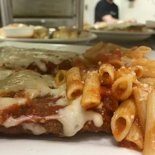 a plate of pasta and meat