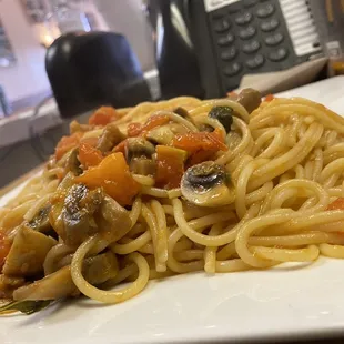 a plate of pasta and vegetables