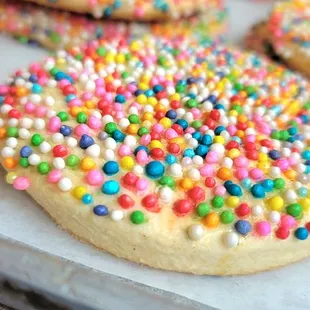 a tray of cookies with sprinkles