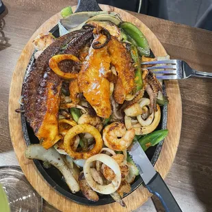 Seafood fajitas (also came with tortillas, rice, beans, guac, and sour cream)