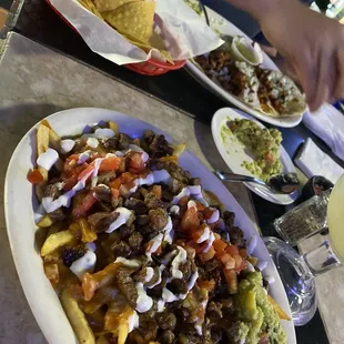 Asada fries and pastor tacos!