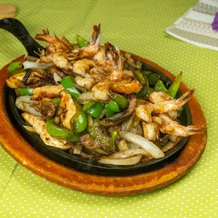 a dish of shrimp and peppers