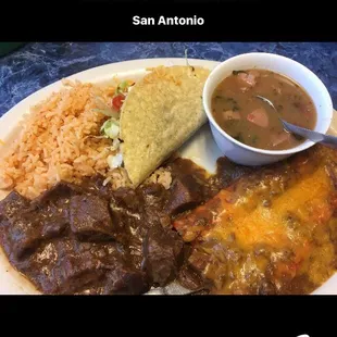 Mexican plate lunch special.. $7.75, 2 cheese enchiladas, 1 crispy chicken taco, carne guisada, charro beans.
