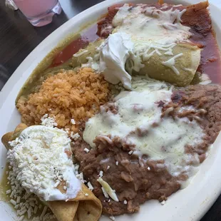 Combo - beef taquito, green chicken enchilada, red pork tamale, rice and beans