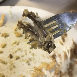 a fork with some food on it