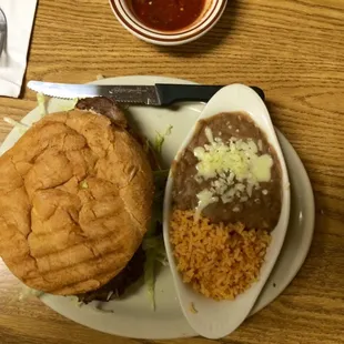 Carne Asada Torta with rice and beans.