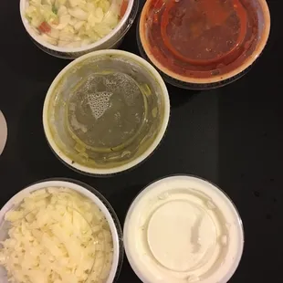 red salsa ok needs onion  green sauce ok  cheese great  sour cream pretty good