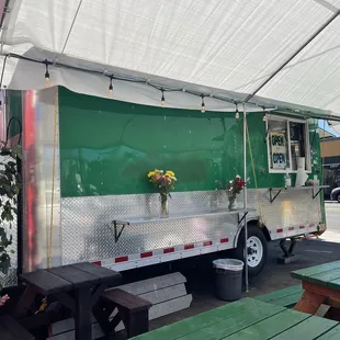 a green and white food truck