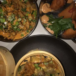 three pans of food on a table