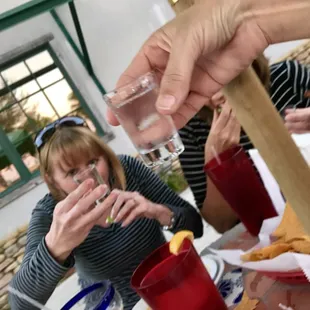 a woman holding a glass of wine