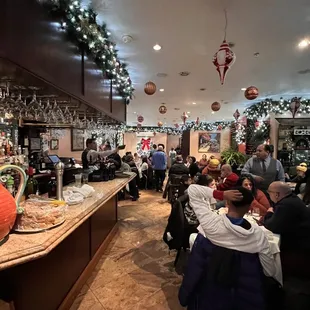 people sitting at tables in a restaurant