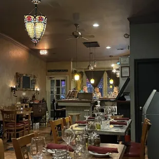 a dining room with a table and chairs