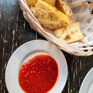 Red dipping sauce for garlic bread.