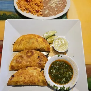 Birria Tacos with side of Rice and Beans