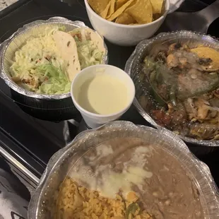 Soft chicken tacos, beans and rice, chips