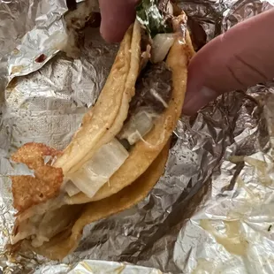 Side view of yummy $4 single Birria taco