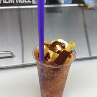Rusa. Squirt soda, oranges, pineapple, Chamoy stick,