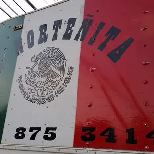 the mexican flag painted on the side of a truck