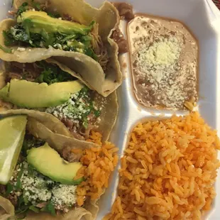 $7 lunch - three mini tacos with rice and beans