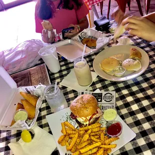 Burger, Empanadas de Queso, Carne y Pollo (Cheese, Beef and Chicken.) plus Arepas de queso.