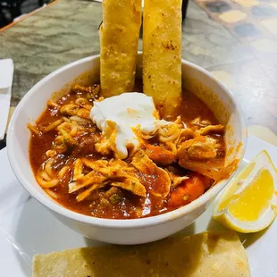 Personalized Enchilada Soup with shredded chicken and taquitos