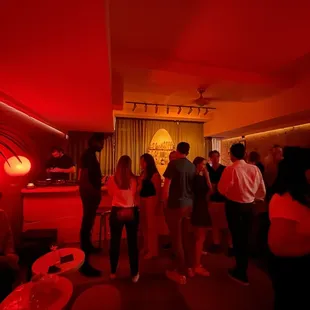 a group of people in a dimly lit room