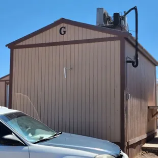 Random "G" building outside behind the restaurant in the parking lot