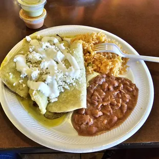 Chicken enchiladas with rice and beans