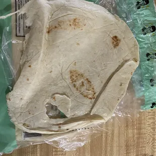 a tortilla wrapped in plastic