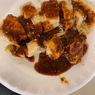 Cut up chicken tamale with superb salsa rojo