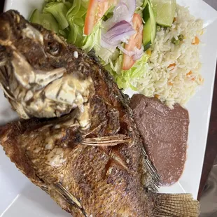 Fried Tilapia with rice, beans and salad.