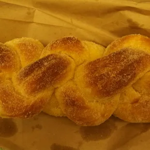 three bread rolls on a brown paper bag