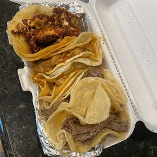 a tray of tacos and chips