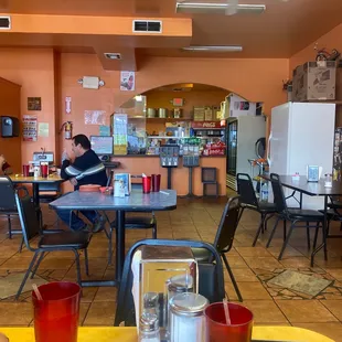 a man sitting at a table in a restaurant