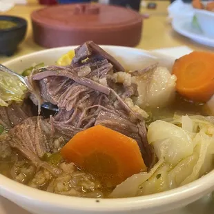 a bowl of beef and vegetables