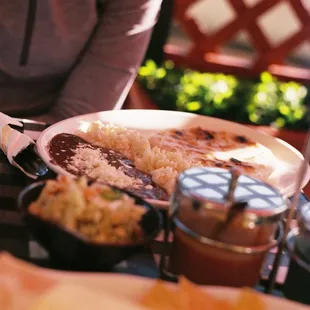 Steak and cheese pupusa with Rice and Beans