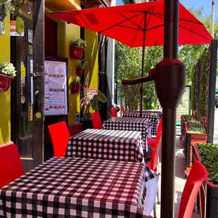 Pleasant, covered outdoor seating along the sidewalk.