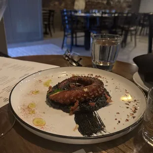 Octopus with black risotto