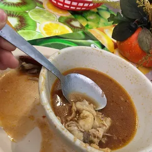 a bowl of soup with a spoon