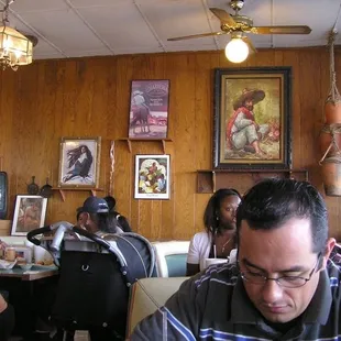 My friend's forehead, families eating, and the lovely "retro" wall.