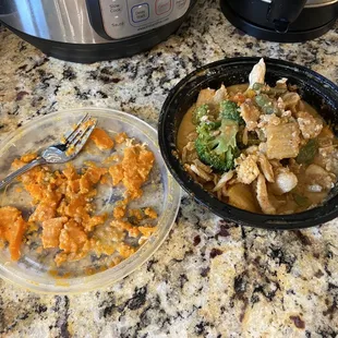 Left side is all congealed fat/oil I scraped off the top of the food after it sat in the fridge overnight. Panang curry with chicken.