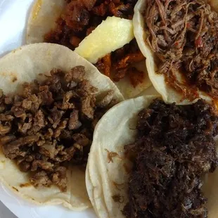 a plate of pulled pork tacos