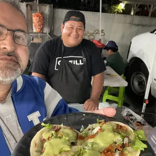 a man holding a plate of food