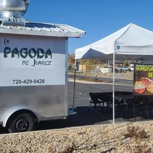 a food truck parked on the side of the road