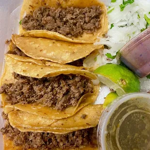 Four mystery meat tacos.