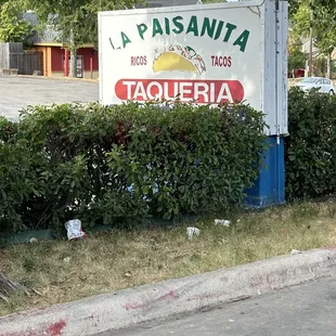 a sign for taqueria