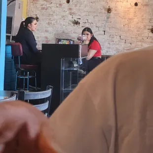 two people sitting at a table