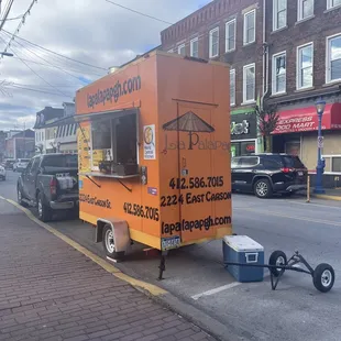 a food truck parked on the side of the road