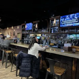people sitting at the bar
