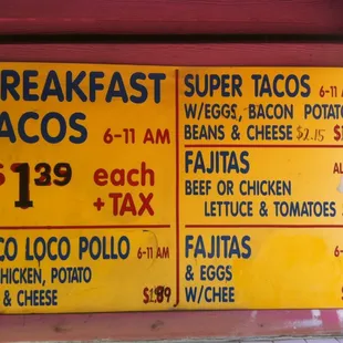 a sign for breakfast tacos